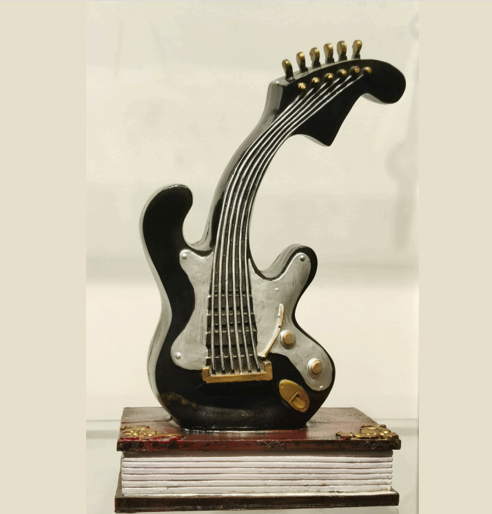 Miniature Electric Guitar on Book – Rock 'n' Roll Accent