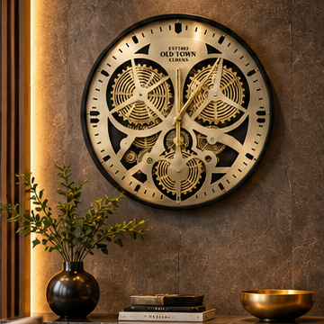 Brass gear wall clock with large exposed moving cogs and a black rim, 50 cm - styled in a living room