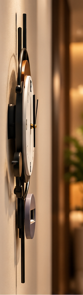 Black ring wall clock with a copper crescent behind the dial and a digital display, 20 x 30 cm - side profile showing depth from the wall