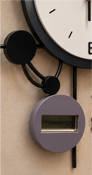Black ring wall clock with a copper crescent behind the dial and a digital display, 20 x 30 cm - close-up of the digital display module