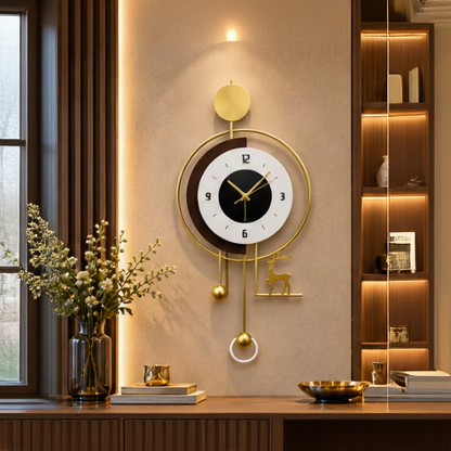 Gold deer pendulum wall clock with a black and white dial and gold ball pendulum, 20 x 30 cm - styled above a console table
