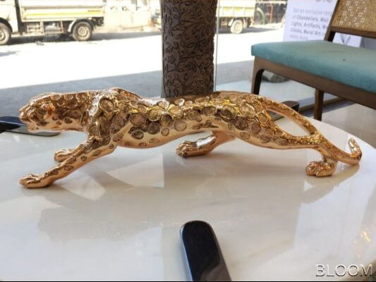 Gilded Hunter: Textured Leopard Sculpture