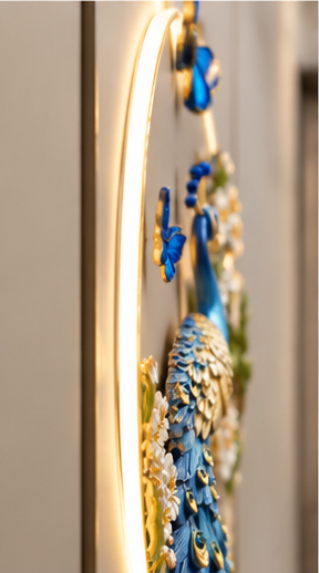 Royal blue peacock LED wall art with gold-eyed tail feathers, white blossoms and butterflies, 24 x 52 inch - side profile showing depth from the wall
