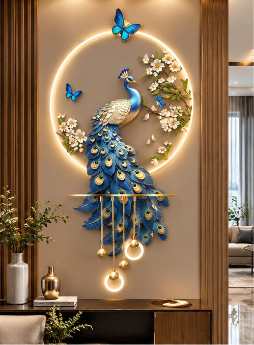 Royal blue peacock LED wall art with gold-eyed tail feathers, white blossoms and butterflies, 24 x 52 inch - styled above a console table